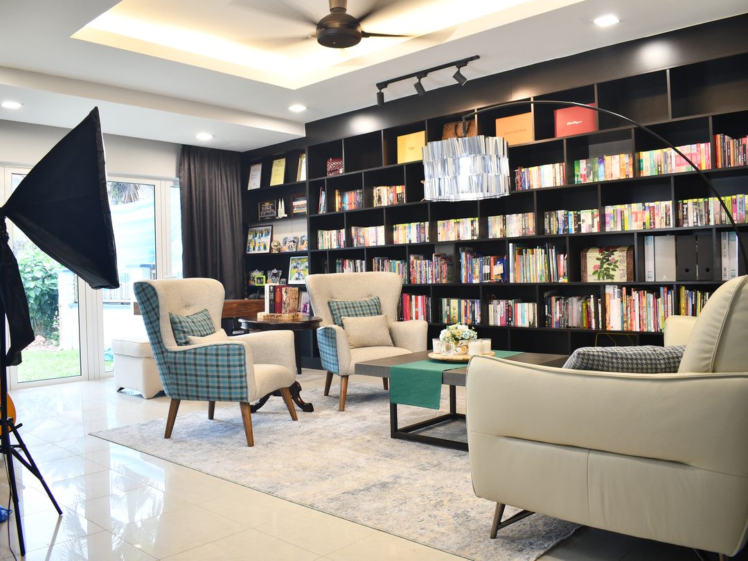 Library living room, floor-to-ceiling shelving across the wall
