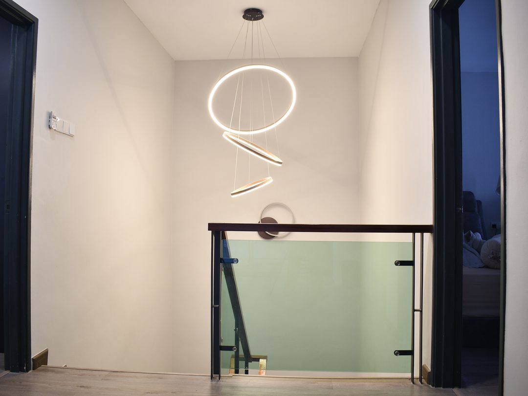 Stair void with sculptural ring pendant