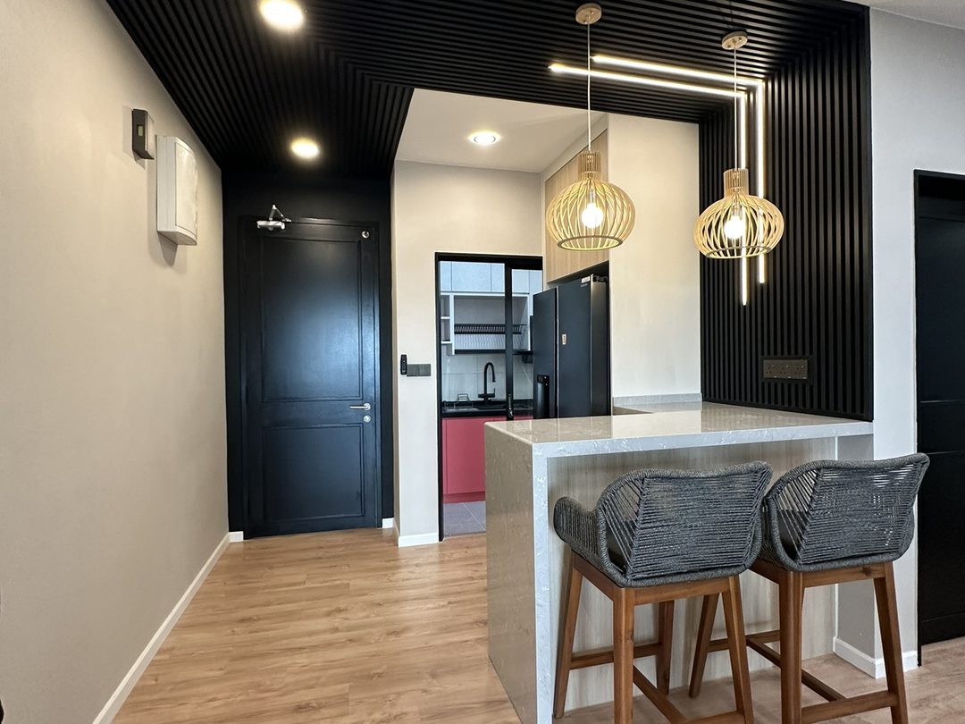 Island counter under rattan pendant lights