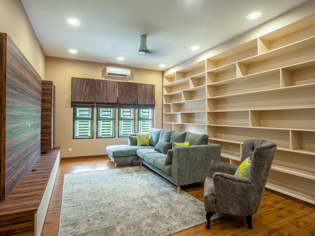 Reading lounge with full-height shelving and soft seating
