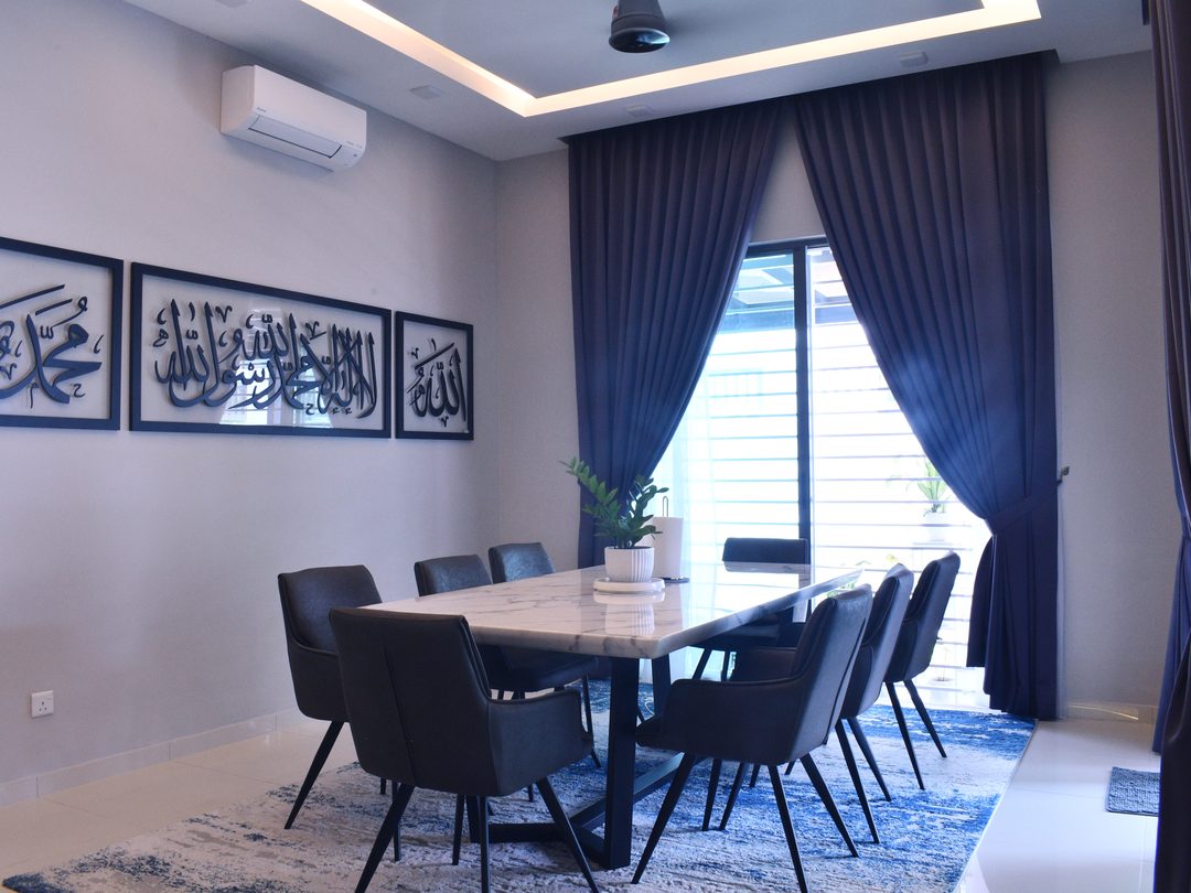 Dining room with upholstered chairs and calligraphy art