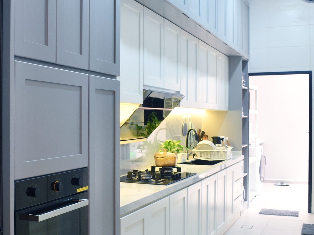 Galley kitchen with two-tone shaker cabinets