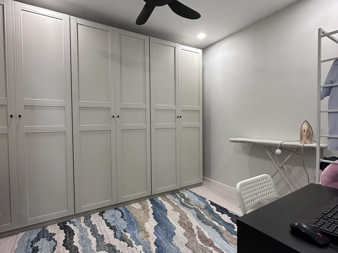 Study with full-height wardrobes and a patterned rug
