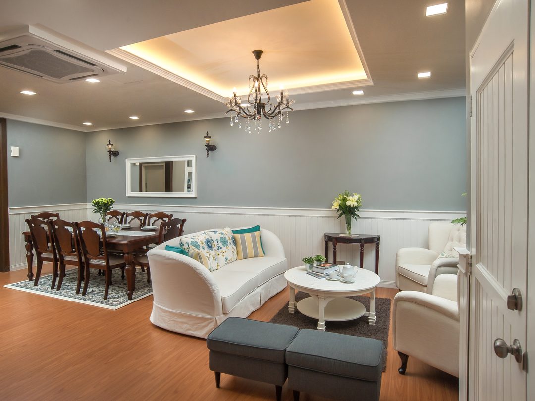 Living and dining hall under a chandelier