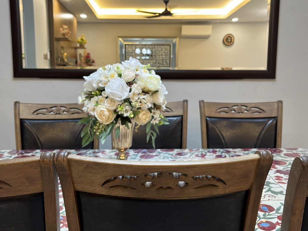 Dining table with carved timber chairs