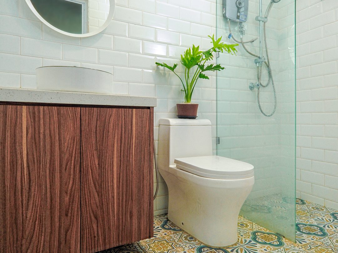 Bathroom with patterned floor tiles and timber vanity