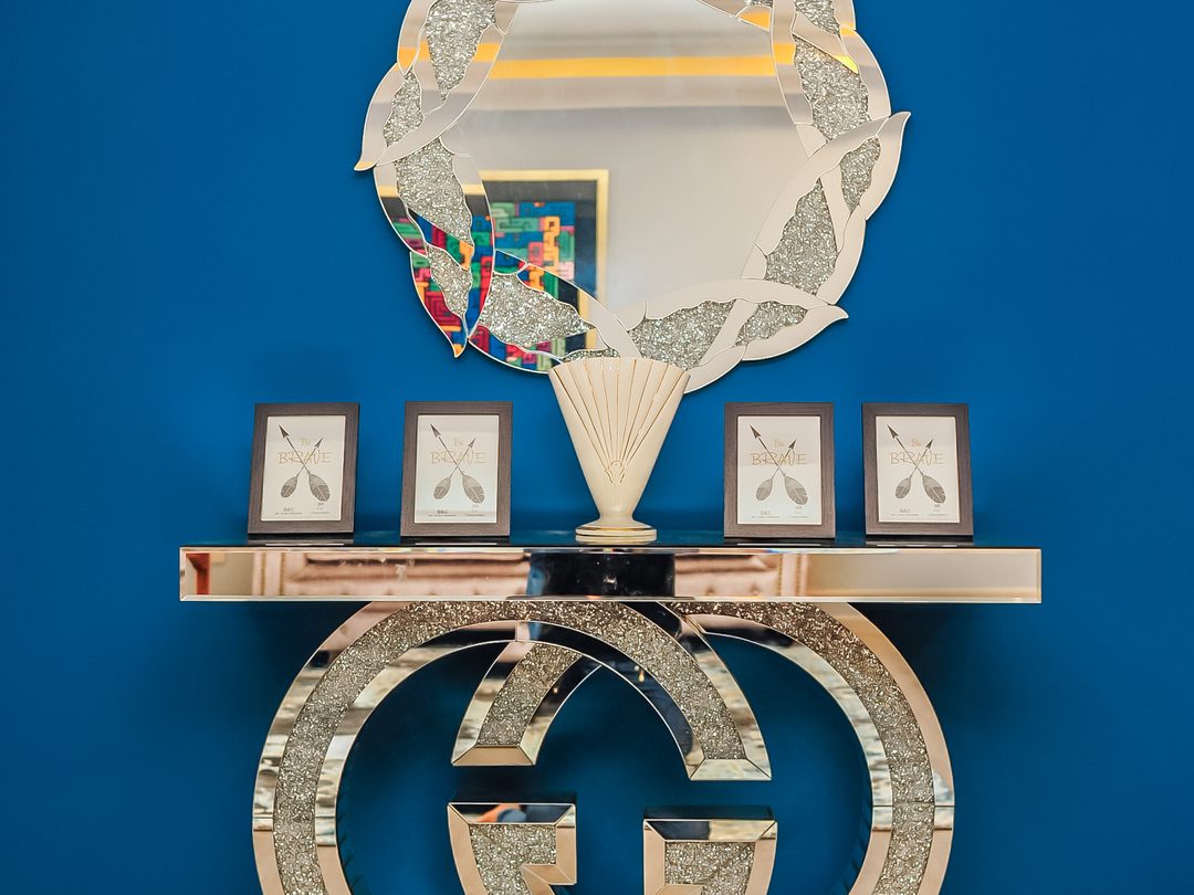 Entry console against a royal blue feature wall