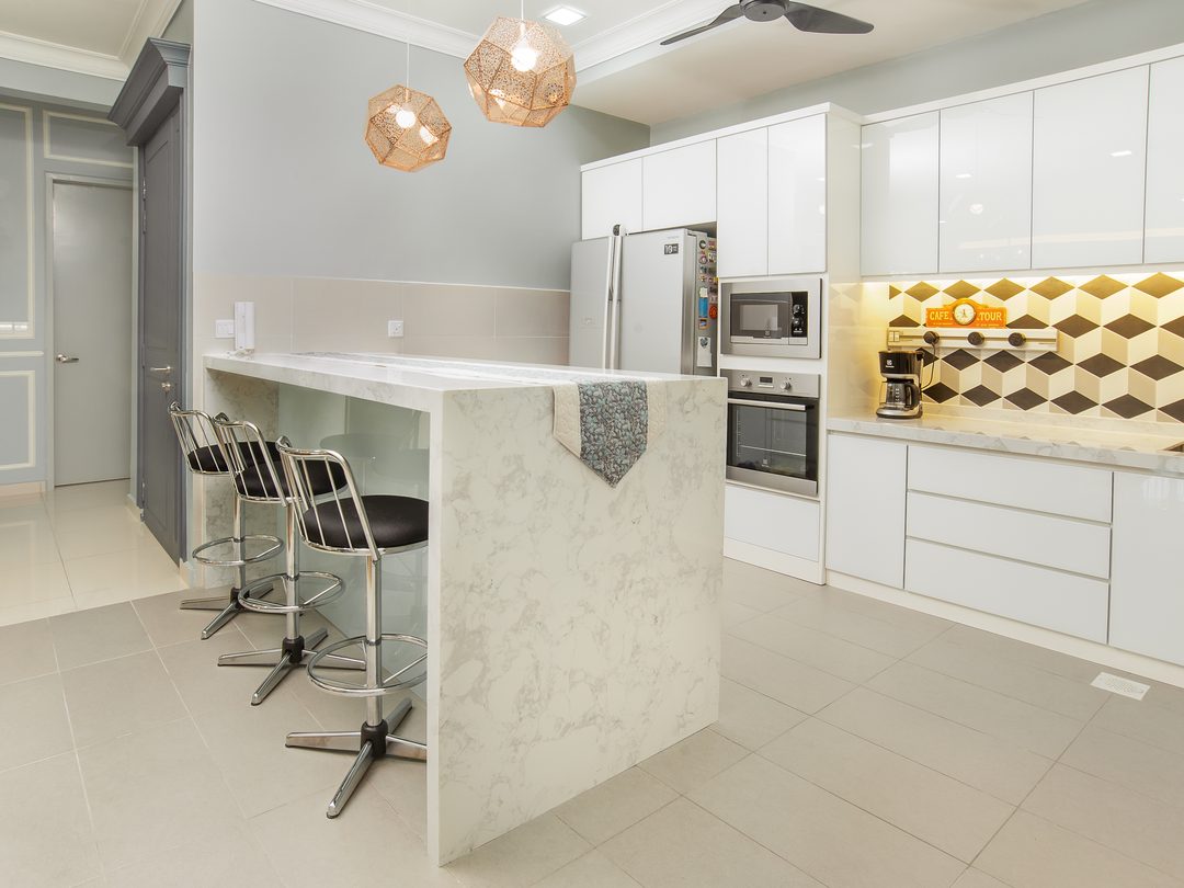 Kitchen in white with marble waterfall island