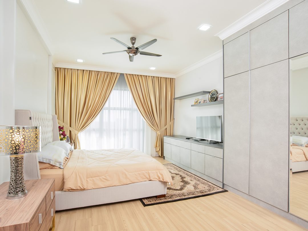 Bedroom with built-in media wall and gold drapes