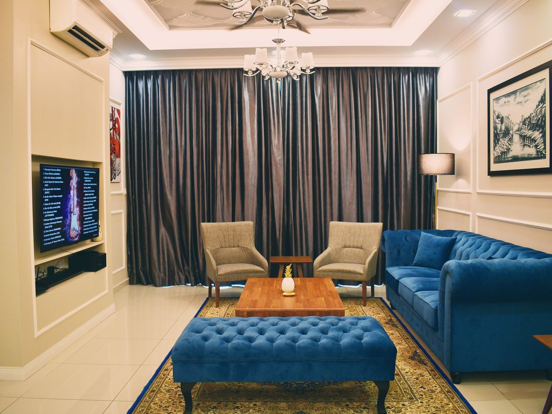 Family lounge with wall panelling and chandelier